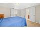 Bedroom with carpet floors, closet, and ensuite bath at 9811 Hidden Ln # 2, Port Richey, FL 34668