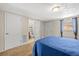 Bedroom with carpet floors and ensuite bath at 9811 Hidden Ln # 2, Port Richey, FL 34668