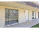 A cozy condo featuring a private entrance and large sliding glass doors at 9811 Hidden Ln # 2, Port Richey, FL 34668