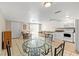 Open concept living space includes kitchen, dining, and seating areas with neutral paint at 9811 Hidden Ln # 2, Port Richey, FL 34668