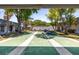 Outdoor shuffleboard courts with picnic tables and benches at 9811 Hidden Ln # 2, Port Richey, FL 34668