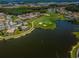 Beautiful aerial view of the neighborhood with a golf course and lakeside homes at 1013 Sweet Jasmine Dr, Trinity, FL 34655
