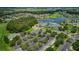 Aerial view showcasing the community, clubhouse, and parking area at 1013 Sweet Jasmine Dr, Trinity, FL 34655