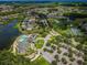 Stunning aerial view showcasing the community, golf course, and lake views at 1013 Sweet Jasmine Dr, Trinity, FL 34655
