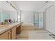 Bathroom features a shower, bathtub, and double vanity, with natural light at 1013 Sweet Jasmine Dr, Trinity, FL 34655