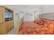 Comfortable bedroom with ceiling fan, large bed and entertainment center at 1013 Sweet Jasmine Dr, Trinity, FL 34655