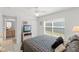 Bedroom with neutral walls and a plush bed with a woven headboard and side tables at 1013 Sweet Jasmine Dr, Trinity, FL 34655