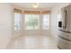 Bright breakfast nook area with tile flooring, corner windows, and lots of light at 1013 Sweet Jasmine Dr, Trinity, FL 34655
