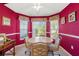 Bright dining area featuring a round table, comfortable chairs, and views of the surrounding greenery at 1013 Sweet Jasmine Dr, Trinity, FL 34655