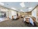 Elegant dining room set up with tables, chairs, and neutral decor, offering a sophisticated space for community meals and events at 1013 Sweet Jasmine Dr, Trinity, FL 34655