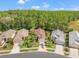 A charming exterior view of a well-maintained single-Gathering home with manicured lawn and mature landscaping and trees at 1013 Sweet Jasmine Dr, Trinity, FL 34655