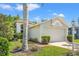 Single-Gathering home with a two-car garage, lush lawn, and tropical landscaping at 1013 Sweet Jasmine Dr, Trinity, FL 34655