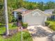 Charming single-story home with a two-car garage, well-manicured lawn, and mature landscaping at 1013 Sweet Jasmine Dr, Trinity, FL 34655
