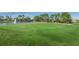 Well-manicured green, showcasing the lush golf course and tranquil water features at 1013 Sweet Jasmine Dr, Trinity, FL 34655