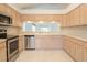 Well-equipped kitchen featuring stainless appliances and lots of cabinet storage at 1013 Sweet Jasmine Dr, Trinity, FL 34655