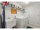 Clean laundry room features a utility sink, ample storage, and washer/dryer at 1013 Sweet Jasmine Dr, Trinity, FL 34655