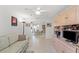 Bright living room flows into the dining room, and features a cream colored couch at 1013 Sweet Jasmine Dr, Trinity, FL 34655