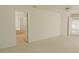 Spacious main bedroom leading to the bathroom, offering a comfortable and convenient layout at 1013 Sweet Jasmine Dr, Trinity, FL 34655