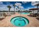 Beautiful pool and hot tub area surrounded by lounge chairs, tables, and lush landscaping, ideal for leisure and recreation at 1013 Sweet Jasmine Dr, Trinity, FL 34655