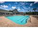 Community pool offering residents a place to swim with patio and sun loungers for relaxation under the sky at 1013 Sweet Jasmine Dr, Trinity, FL 34655