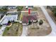 Aerial view of the home featuring a fenced backyard and screened in pool at 1034 Aladdin Rd, Spring Hill, FL 34609