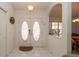 Bright entryway featuring tiled floors, double front doors, and a transom window at 1034 Aladdin Rd, Spring Hill, FL 34609
