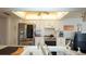 Bright kitchen features white cabinets, stainless steel appliances, and modern lighting at 1034 Aladdin Rd, Spring Hill, FL 34609