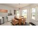 Eat in kitchen area, featuring lots of light and a table with 4 chairs at 1034 Aladdin Rd, Spring Hill, FL 34609