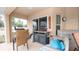 Enclosed patio area with grill, cabinets and chairs at 1034 Aladdin Rd, Spring Hill, FL 34609