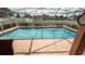 Sparkling rectangular pool with an enclosure, offering a serene and private outdoor experience at 1034 Aladdin Rd, Spring Hill, FL 34609