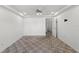 Bright bedroom showcasing a ceiling fan and doorway leading to other rooms at 10540 Noddy Tern Rd, Weeki Wachee, FL 34613