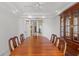 Dining room with wood table and view into other rooms at 10540 Noddy Tern Rd, Weeki Wachee, FL 34613