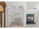 Hallway view with neutral carpet, white walls, and access to multiple rooms at 10540 Noddy Tern Rd, Weeki Wachee, FL 34613