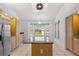 Kitchen featuring granite countertops, stainless steel appliances and island with eat in nook with bay window at 10540 Noddy Tern Rd, Weeki Wachee, FL 34613