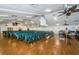 Large auditorium with ample seating, hardwood floors, and modern lighting fixtures at 10641 Timber Ln, Port Richey, FL 34668