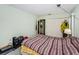 Bedroom with an ensuite bathroom and ample closet space at 10641 Timber Ln, Port Richey, FL 34668