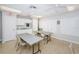 A common kitchen and dining area featuring tables and chairs, perfect for community gatherings and shared meals at 10641 Timber Ln, Port Richey, FL 34668