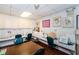 Resident craft room featuring multiple sewing machines, tables, and storage areas for crafting projects at 10641 Timber Ln, Port Richey, FL 34668