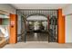 Ornate gated entryway with tile flooring leading into the common area at 10641 Timber Ln, Port Richey, FL 34668