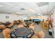Spacious community game room with pool tables and poker tables for resident entertainment and socializing at 10641 Timber Ln, Port Richey, FL 34668