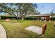 Community lawn game area with horseshoe pits and covered pavilion for neighborhood fun at 10641 Timber Ln, Port Richey, FL 34668