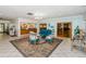 Comfortable lobby area with stylish seating, neutral flooring, and plenty of natural light at 10641 Timber Ln, Port Richey, FL 34668