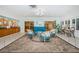 Comfortable lobby area with stylish seating, neutral flooring, and plenty of natural light at 10641 Timber Ln, Port Richey, FL 34668