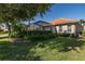Beautiful view of the backyard with well-maintained landscaping and mature trees at 10701 Ruffino Ct, Trinity, FL 34655
