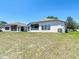 Expansive backyard showcases a large, well-maintained lawn with ample space for recreation and relaxation at 1082 Nodding Shade Dr, Brooksville, FL 34604