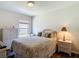 Cozy bedroom with wicker furniture and a queen-size bed at 1082 Nodding Shade Dr, Brooksville, FL 34604
