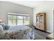 Bedroom with a view, decorative cabinet and marine-themed decor at 1082 Nodding Shade Dr, Brooksville, FL 34604