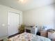 Bright bedroom featuring a sewing desk, closet and a light color palette at 1082 Nodding Shade Dr, Brooksville, FL 34604
