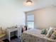 Inviting bedroom with a desk, window view and comfortable decor at 1082 Nodding Shade Dr, Brooksville, FL 34604