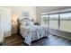Relaxing bedroom with a landscape view and wrought iron bed at 1082 Nodding Shade Dr, Brooksville, FL 34604